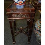A pair of reproduction mahogany fretwork occasional tables in the Chinese Chippendale style,
