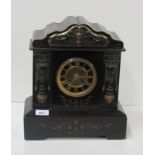 A heavy black marble Victorian Mantle Clock, with gilt decoration and attractive brass mounts.