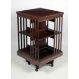 An Edwardian inlaid mahogany Revolving Bookstand, with slatted sides, 32 1/2"h x 19 1/5"w.