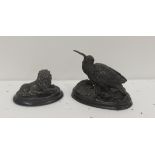 A small well modelled Figure of a Curlew, signed Chemin, and a small metal Figure of a seated Lion.