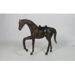 An unusual miniature leather model of a Horse, approx. 64cms (25").