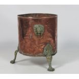 A Georgian style brass Peat / Coal Bucket, with lion mask handles on paw feet.