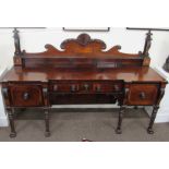 An early 19th Century Nelson style carved and inlaid mahogany Sideboard, of inverted outline,
