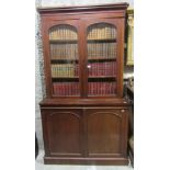 A good Victorian mahogany Bookcase, with two arched glazed doors over two arched panel doors below,