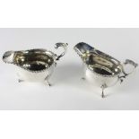 A pair of heavy English silver Sauceboats, each with gadroon borders and shell and pad feet,