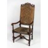 A carved William & Mary style walnut high back Open Armchair,