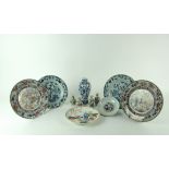 Seven 19th Century Oriental blue and white, and rust coloured Plates,