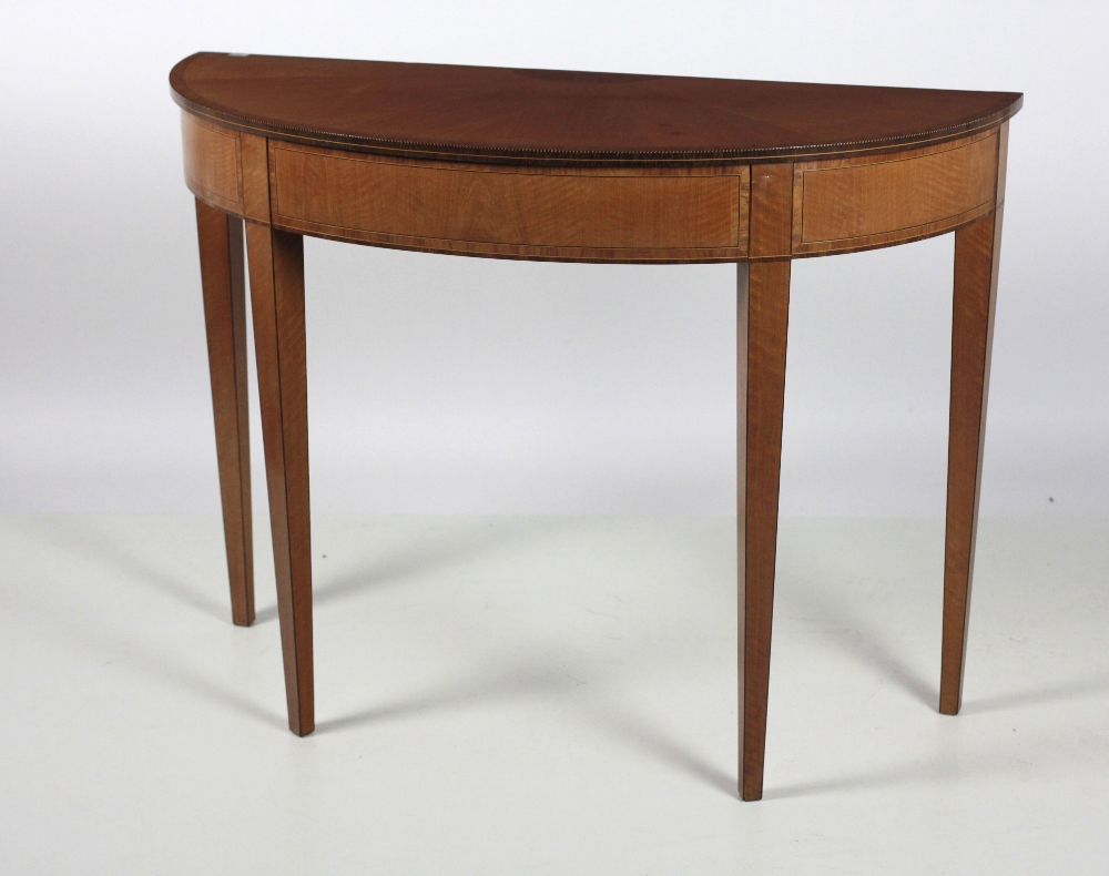 An attractive Irish demi-lune satinwood Side Table, with crossbanded and segmented top,