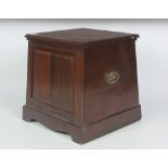 An Edwardian walnut Commode of tapering square shape, fitted with porcelain bucket.