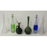 A pair of cutglass trumpet shaped Decanters and stoppers, an old Bristol green glass Claret Jug,
