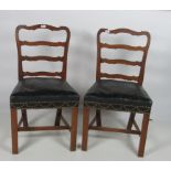 A pair of 19th Century mahogany ladder back Dining Chairs,