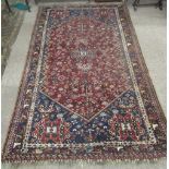 A good quality 19th Century Middle Eastern Rug, the claret ground centre with shaped design,