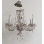 A single tier six branch coloured ruby glass Chandelier, decorated with cutglass drops and droplets,