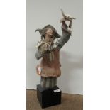 An unusual Lladro Figure of a Jester or Perriot, with dove in hand, in typical pose,