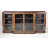 A Regency rosewood and brass inlaid breakfront Vitrine,