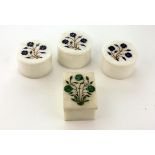 A set of three circular Pietra Dura marble Pots and lids, each with floral inset design,
