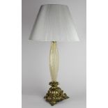 An attractive shaped, reeded and bubble glass Table Lamp & Shade, on a heavy triform brass base,