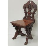 A very heavy carved and pierced Victorian oak Hall Chair.