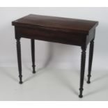 An early 19th Century Nelson style mahogany swivel top fold-over Card Table,