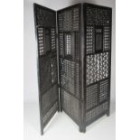 An unusual Syrian carved and bobbin turned Arabesque three fold ebonised Screen,