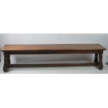 A 19th Century oak Furm / Long Bench, on turned feet with plain stretcher, approx. 7' (213cms).