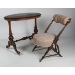 An unusual late Victorian walnut Chair, with upholstered rolled back,