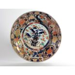 An extremely fine large 19th Century Japanese Imari Charger, decorated with deep blues,