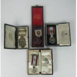 Four silver and enamel Masonic Medals, with ribbons, all cased.