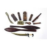 An Oriental Dagger, in brass scabbard, an Oriental decorated brass paper Knife,