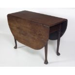 An Irish 19th Century mahogany drop leaf gate leg Table, with ball n' claw feet, approx.