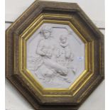 An octagonal carved composition Plaque, possibly marble, "Mythical Subject,