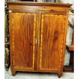 A 19th Century two door Wardrobe, the cornice with Greek key moulding,
