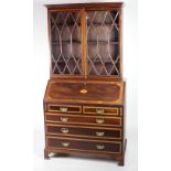 A good quality George III inlaid and crossbanded slope front Bureau Desk,