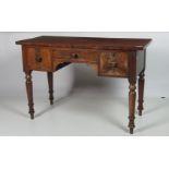 A small rectangular early Victorian mahogany knee-hole Dressing Table, with three frieze drawers,
