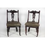 A good set of 12, late Victorian carved walnut Dining chairs, hide covering.