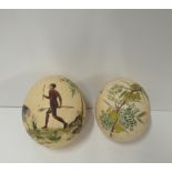 A pair of painted Ostrich Eggs, decorated with aboriginal figure and ostrich.
