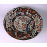 A large 18th Century Japanese Imari Dish, 55cms (21 1/2") diameter, decorated with exotic birds,