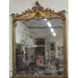 A large early Victorian giltwood Console Mirror, with heavy carved rococo design on top,