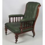 A similar pair of Victorian walnut Library Chairs, with carved and shaped backs,