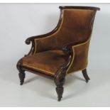 A William IV Irish mahogany Armchair, with curved and spiral design back and turned arms,