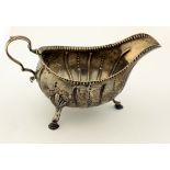 A good 18th Century early George III period Irish silver Sauceboat, with beaded rim and reeded body,