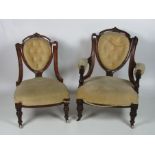 A matching pair of Victorian Ladies & Gents carved walnut Parlour Chairs, covered in lemon draylon.