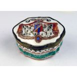 A small attractive hand painted porcelain Pill Box, the lid decorated with Continental coat of arms,