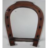 A heavy oak Wall Mirror, in the shape of a horseshoe, approx. 102cms (40").