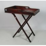 An early Victorian mahogany Butlers Tray, and original folding stand.