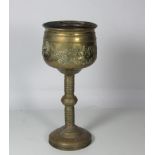 A 19th Century hand beaten brass Jardiniere, with attached circular stand.