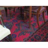 A good Turkish design crimson ground Rug, with large border and blue and green colouring, approx.