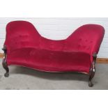 A Victorian serpentine Settee, with scroll handles on cabriole legs, covered in red draylon, approx.