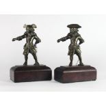 An unusual pair of 19th Century brass Figures, "Fighting Cavaliers," on wooden stands, approx.