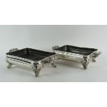 A good heavy pair of early 19th Century silver plated Dish Stands, with scroll feet.